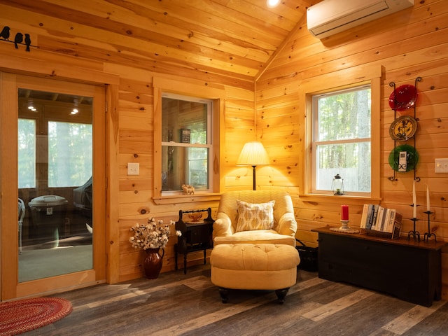 living area with a wall unit AC, wooden ceiling, wooden walls, lofted ceiling, and dark hardwood / wood-style floors