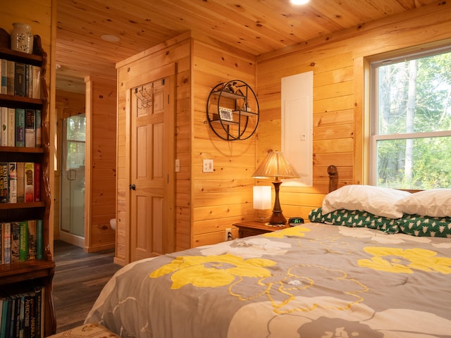 bedroom featuring wood walls, dark hardwood / wood-style floors, and wooden ceiling