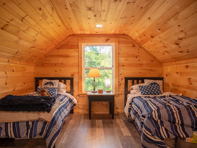 bedroom with lofted ceiling, wooden walls, hardwood / wood-style floors, and wooden ceiling