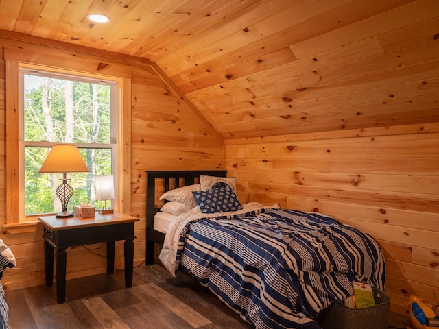 bedroom featuring vaulted ceiling, wooden walls, hardwood / wood-style floors, and wood ceiling