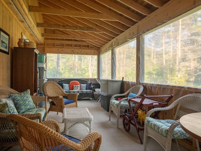 sunroom featuring lofted ceiling