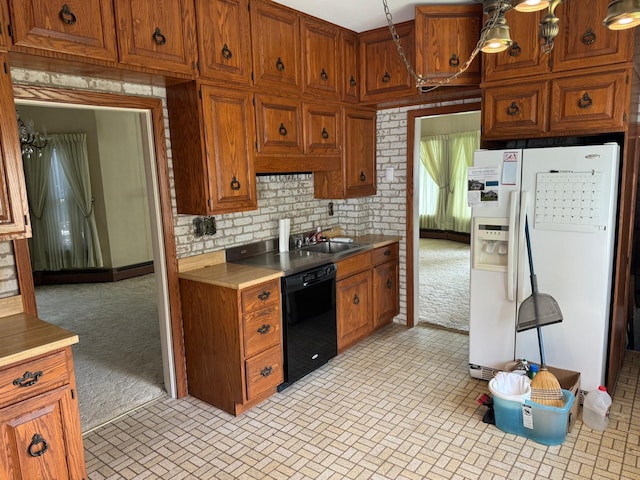 kitchen featuring sink, tasteful backsplash, dishwasher, white fridge with ice dispenser, and light colored carpet