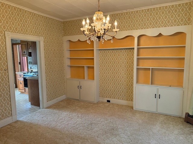 unfurnished dining area with crown molding, built in shelves, a notable chandelier, and light carpet