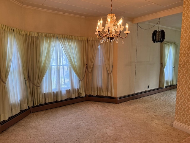 carpeted spare room with crown molding and an inviting chandelier