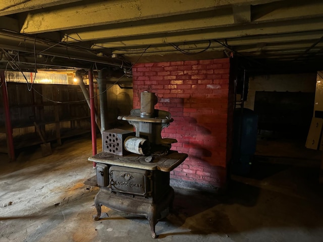 basement featuring brick wall