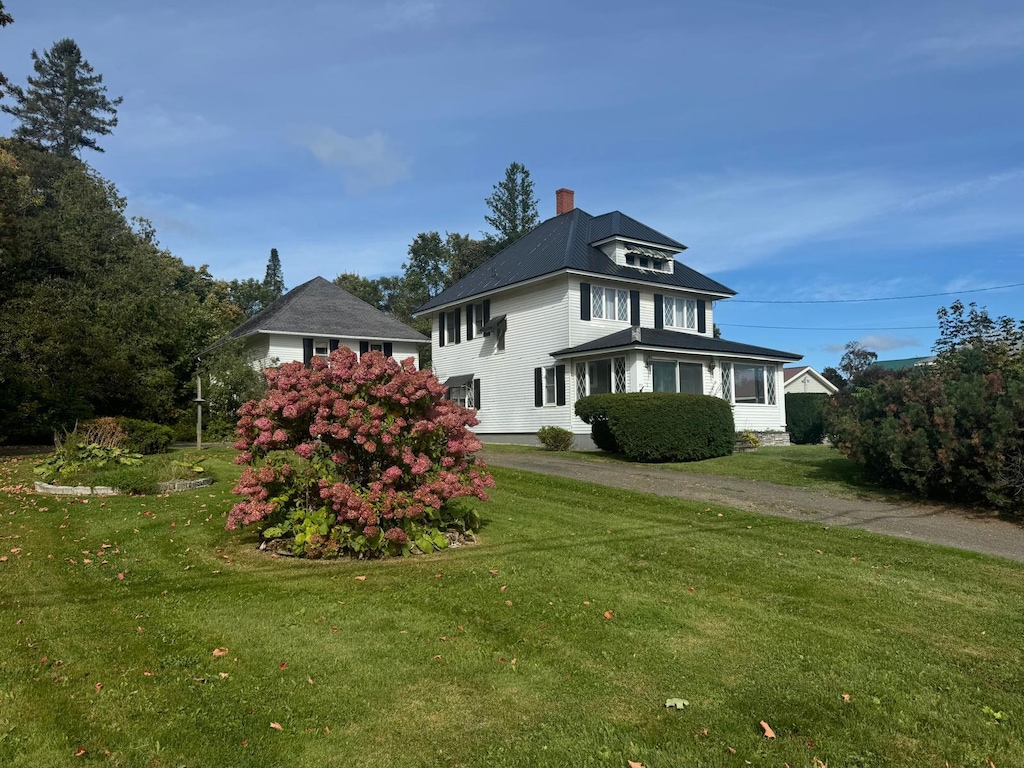 22 Main St, Mars Hill, ME 04758 - view of side of home with a yard and a chimney