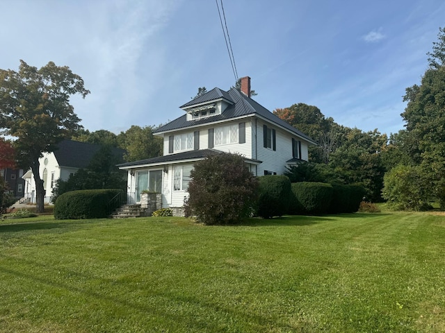 view of property exterior featuring a lawn