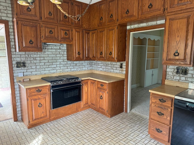 kitchen featuring light carpet and black range