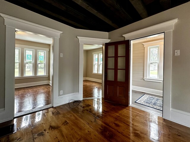 entryway featuring visible vents, baseboards, and hardwood / wood-style floors