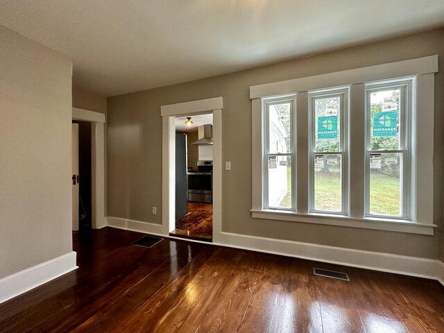 unfurnished bedroom featuring dark hardwood / wood-style floors