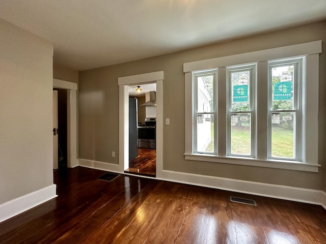 112 S St, Calais, ME 04619 - empty room featuring hardwood / wood-style floors, baseboards, and healthy amount of natural light