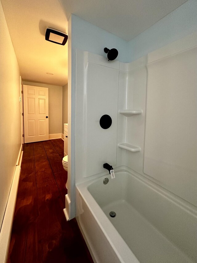 112 S St, Calais, ME 04619 - bathroom featuring toilet, baseboards, wood finished floors, and a baseboard heating unit
