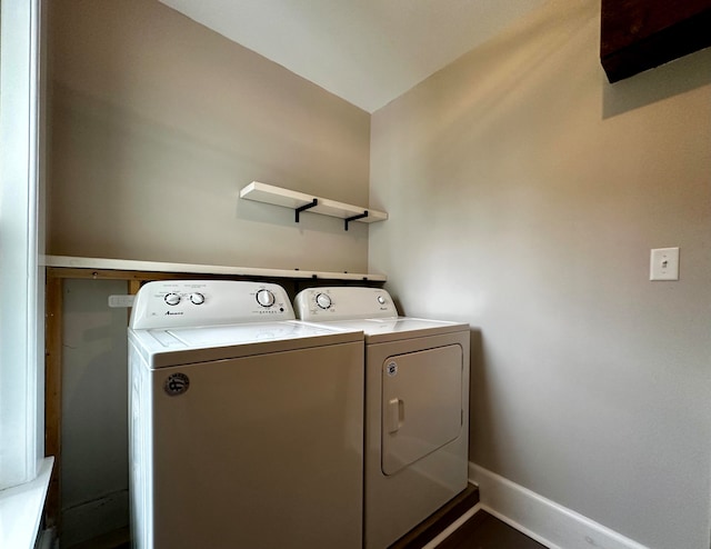 laundry room featuring baseboards, washing machine and dryer, and laundry area