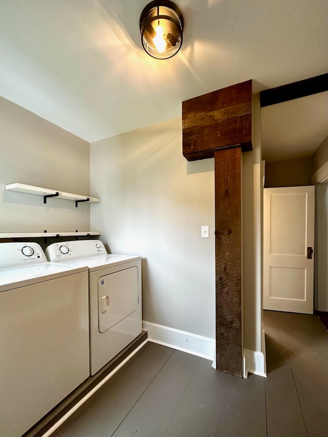 laundry area featuring laundry area, separate washer and dryer, and baseboards