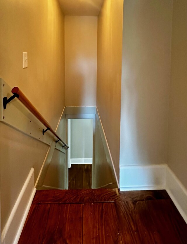 stairs with wood finished floors