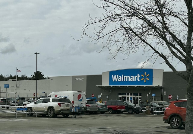 view of property featuring uncovered parking