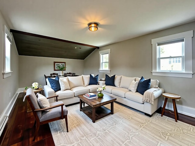 112 S St, Calais, ME 04619 - living room with lofted ceiling, light wood-style flooring, and baseboards