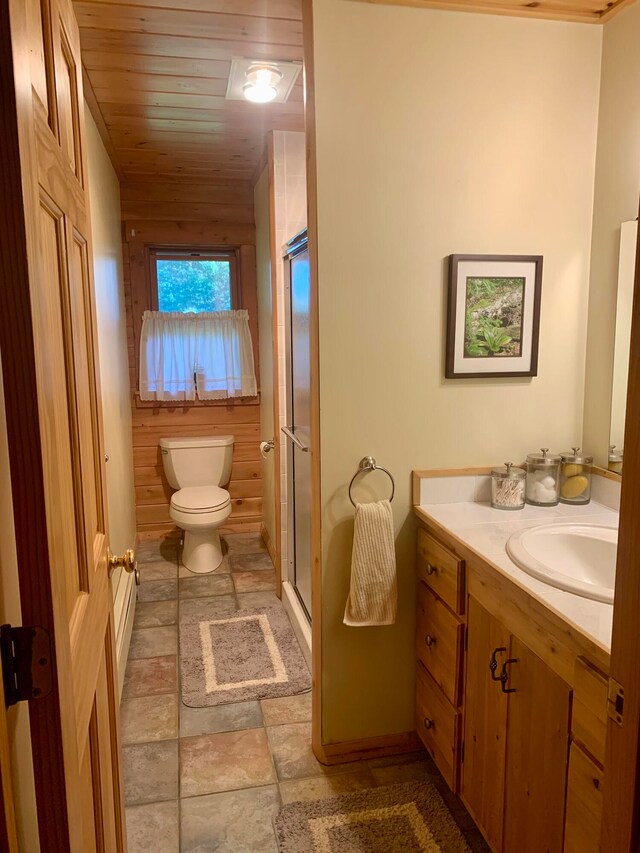 bathroom featuring vanity, wood ceiling, wood walls, an enclosed shower, and toilet