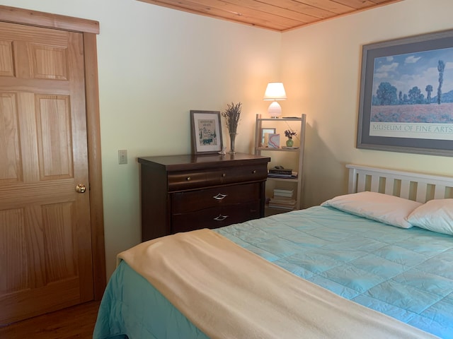 bedroom featuring wood ceiling and hardwood / wood-style floors