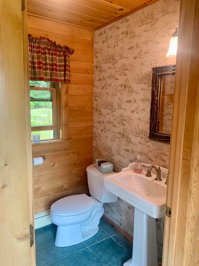 bathroom featuring wood ceiling, wood walls, toilet, and tile patterned floors