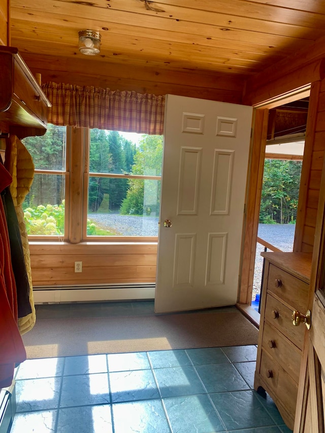 entrance foyer featuring baseboard heating and wood ceiling