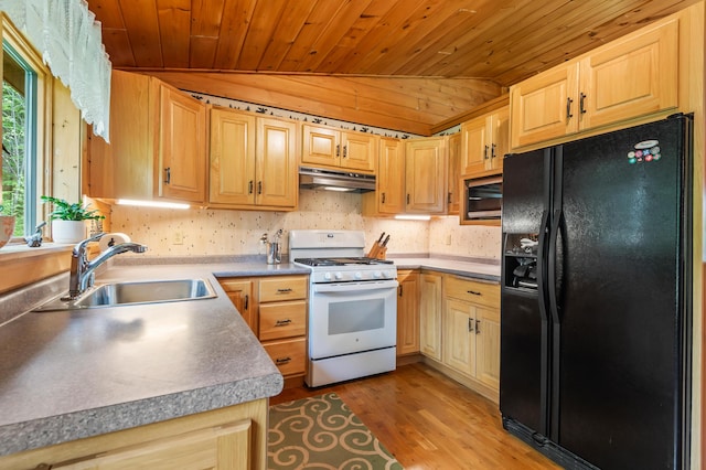 62 Antler Way, Rangeley, ME 04970 - kitchen featuring black fridge, white range with gas cooktop, under cabinet range hood, wood ceiling, and a sink