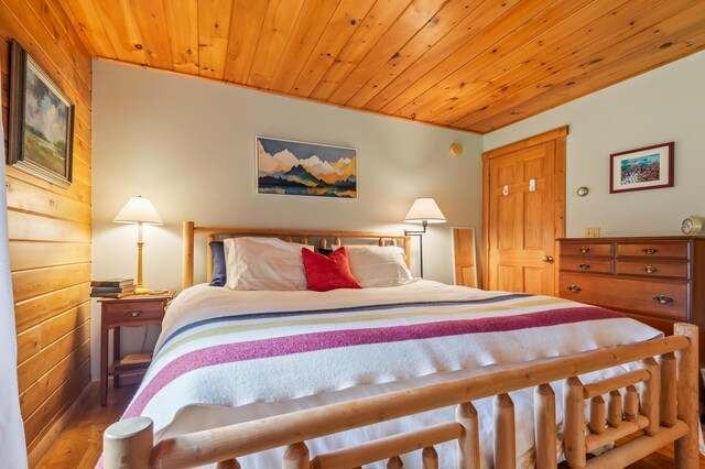 62 Antler Way, Rangeley, ME 04970 - bedroom featuring wood finished floors and wooden ceiling