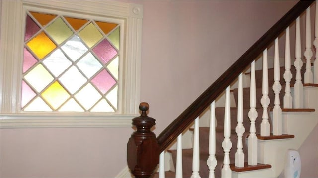 staircase with plenty of natural light