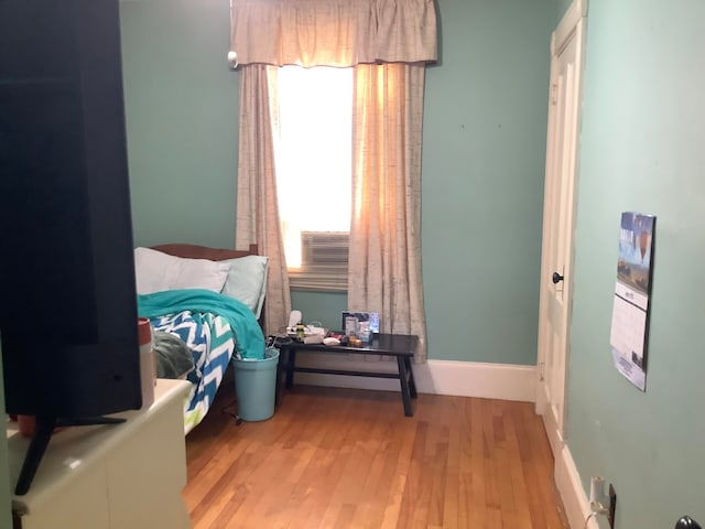 bedroom with light hardwood / wood-style floors