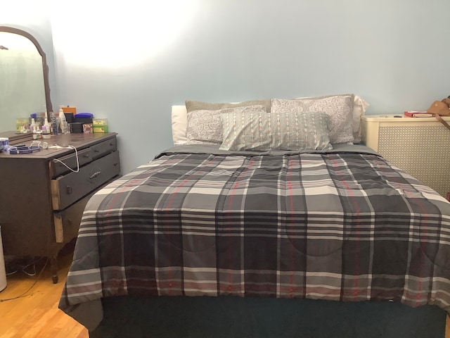 bedroom with hardwood / wood-style floors