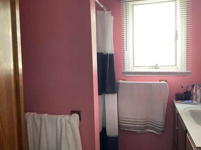 bathroom featuring vanity and a shower with curtain