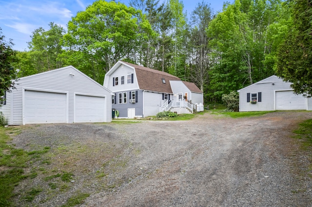 exterior space with an outbuilding and a garage