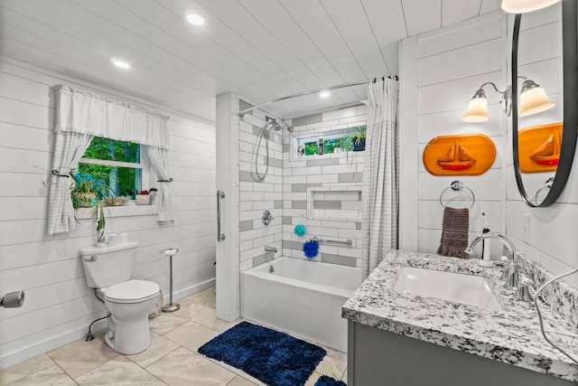 full bathroom featuring shower / bath combo with shower curtain, vanity, and toilet