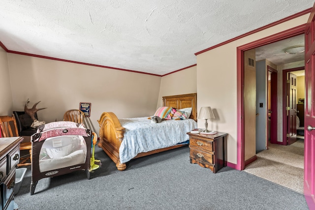 bedroom featuring a textured ceiling, ornamental molding, and carpet floors