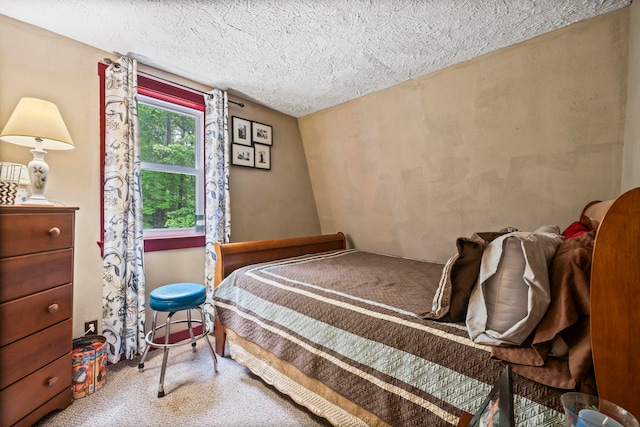 carpeted bedroom with a textured ceiling