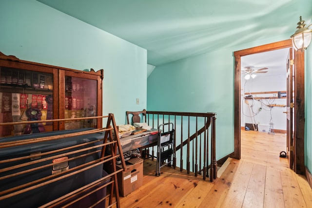 interior space featuring lofted ceiling and hardwood / wood-style floors