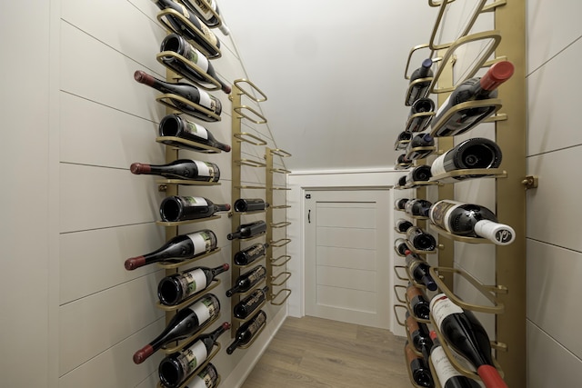 wine area with light wood-type flooring