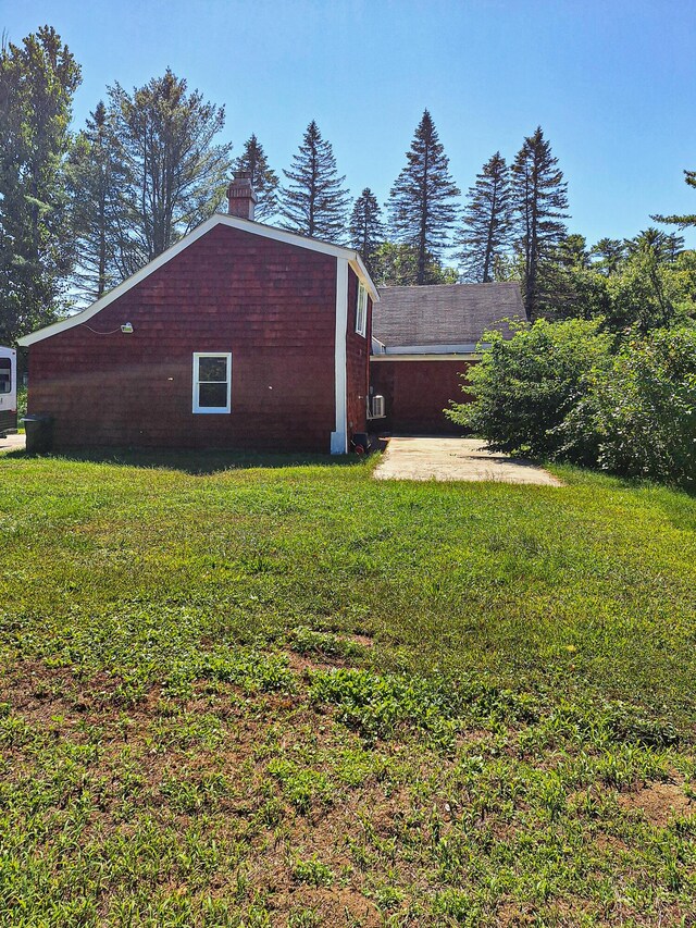 view of property exterior featuring a yard