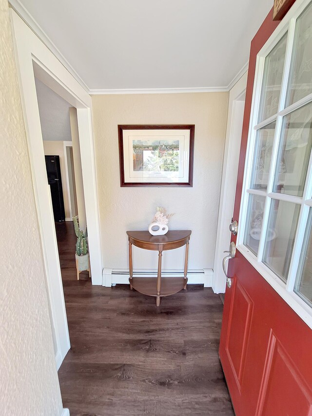 hallway featuring baseboard heating, ornamental molding, and dark hardwood / wood-style flooring