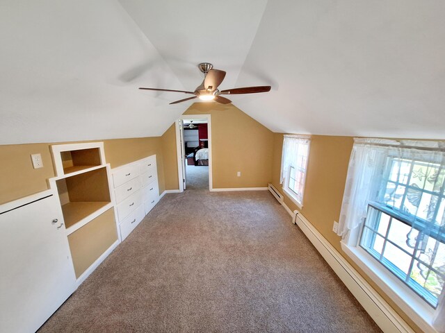 bonus room featuring carpet, lofted ceiling, ceiling fan, and baseboard heating