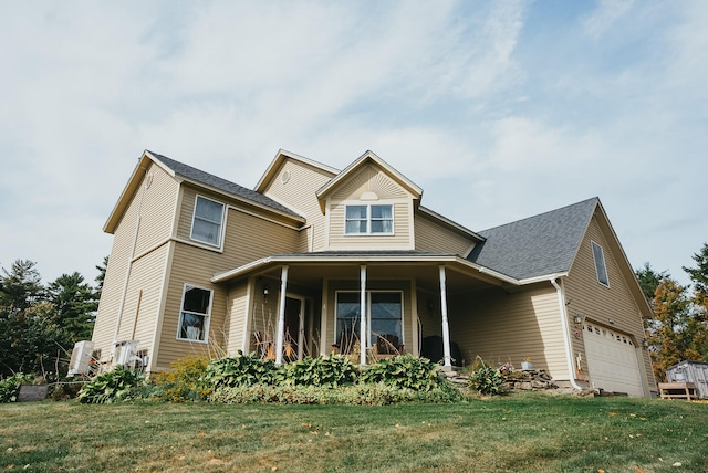 view of front facade featuring a front lawn, a porch, and a garage