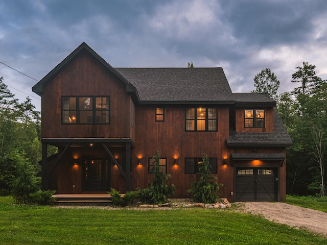 view of front of house with a garage and a front yard