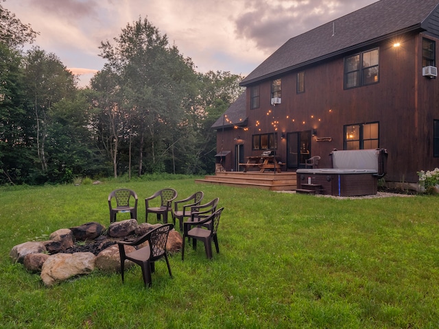 yard at dusk featuring a deck