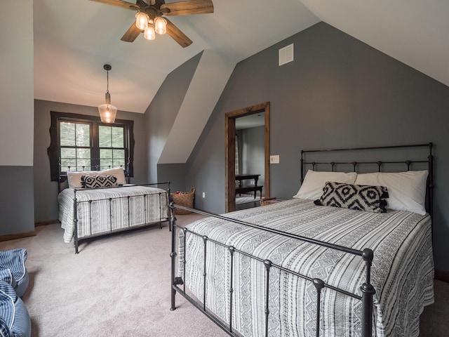 carpeted bedroom featuring lofted ceiling and ceiling fan