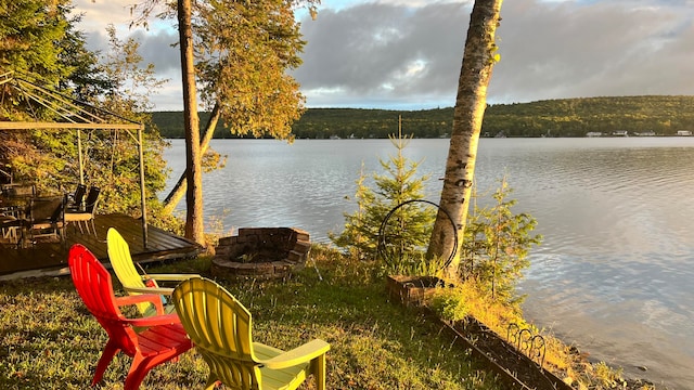 water view featuring an outdoor fire pit