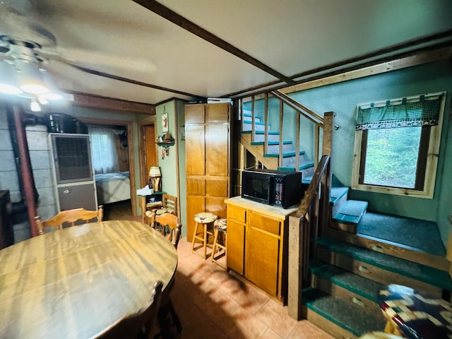 interior space featuring ceiling fan