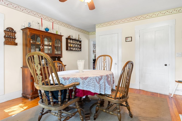 dining room featuring light hardwood / wood-style flooring and ceiling fan