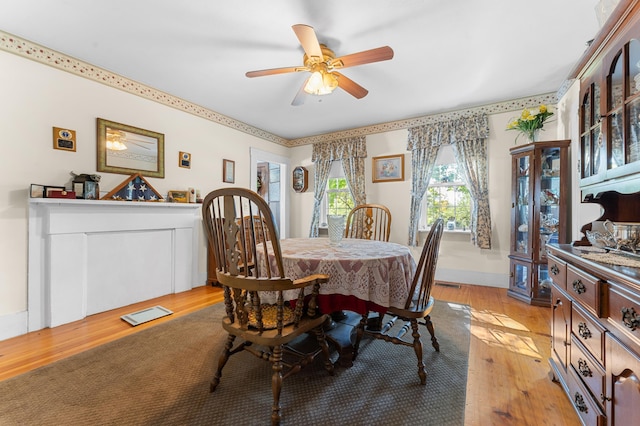 dining area featuring light hardwood / wood-style floors and ceiling fan