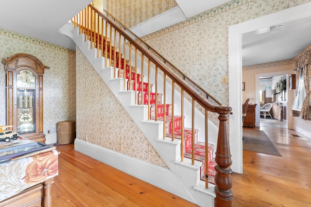 staircase featuring wood-type flooring