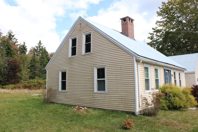 view of home's exterior with a yard